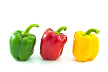Red, Yellow And Green Bell Peppers Isolated On The White Backgro