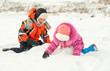 © Evgenia Tiplyashina - Boy and girl playing on the snow