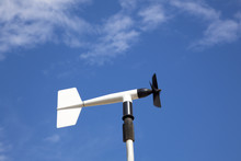 Wind Wheel Or Anemometer With Cloud Background