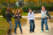 Teenage boys and girls having fun in the park