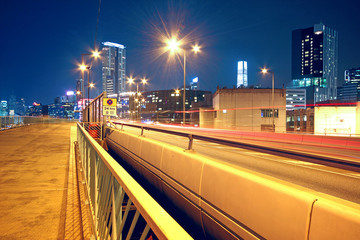 pedestrian overpass and traffic bridge at night