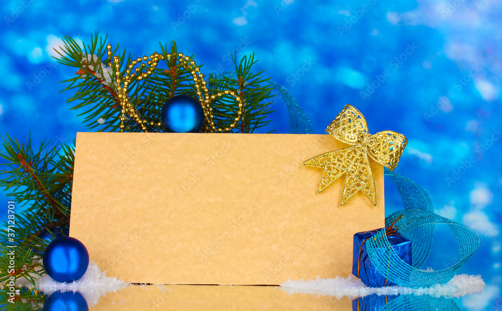 blank postcard, Christmas balls and fir-tree on blue background