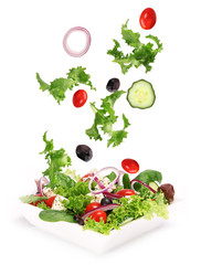 Wall Mural - Fresh salad with vegetable in motion.