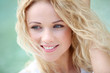 © goodluz - Portrait of beautiful blond smiling woman