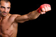 © cristovao31 - Young Boxer fighter over black background