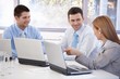 © nyul - Happy team of businesspeople working together
