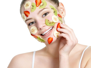 Wall Mural - Woman with fruit facial mask on face