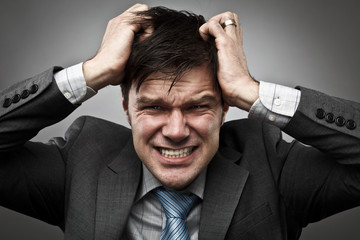 Businessman pulling his hair