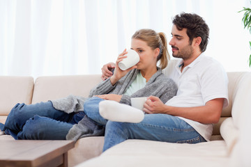 Poster - Young couple having a cup of tea