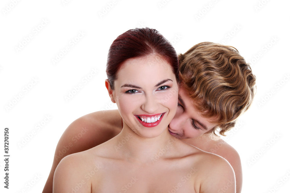 Topless boy kissing his naked girlfriend. Stock Photo | Adobe Stock