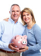 © grinny - Senior couple with a piggy bank.