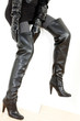 © Richard Semik - detail of sitting woman wearing fashionable black boots
