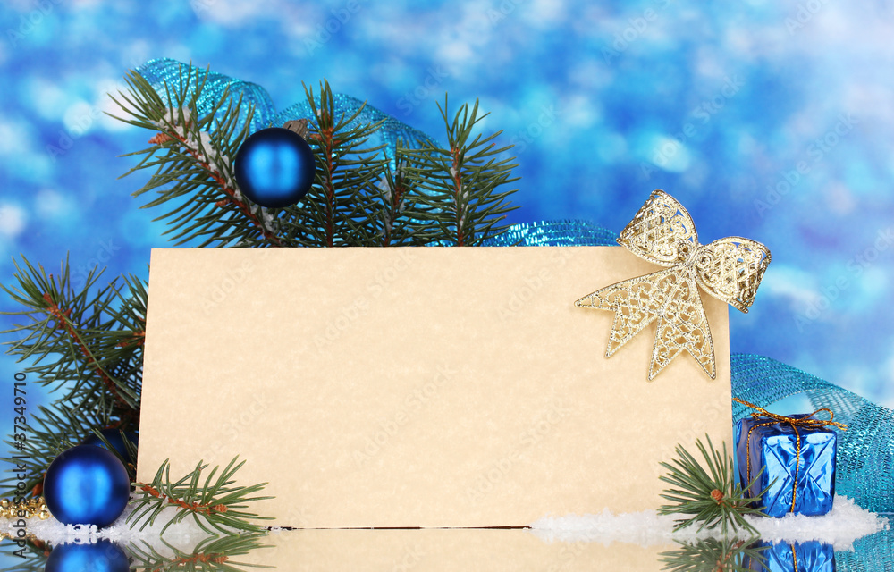 blank postcard, Christmas balls and fir-tree on blue background