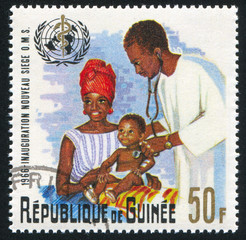 Sticker - Physician examining Infant