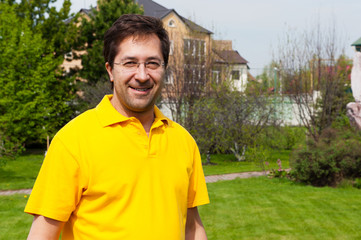 Portrait of adult active healthy man standing relaxed at his bac