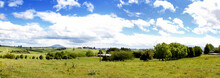 Green Farmland And Blue Sky