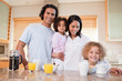 © WavebreakmediaMicro - Happy family having breakfast in the kitchen together