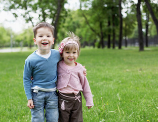 Wall Mural - happy sister and brother outdoors