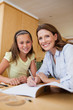 © WavebreakmediaMicro - Mother helping daughter with homework