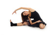 © Slaweek - female ballet dancer in black dress doing exercises on white bac