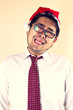 © akeeris - crying Santa, Businessman wear Santa hat act crying.