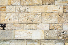 Fragment Of A Stone Wall Made Of Limestone Bricks