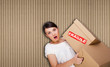 © Milles Studio - Closeup portrait of a young woman with boxes