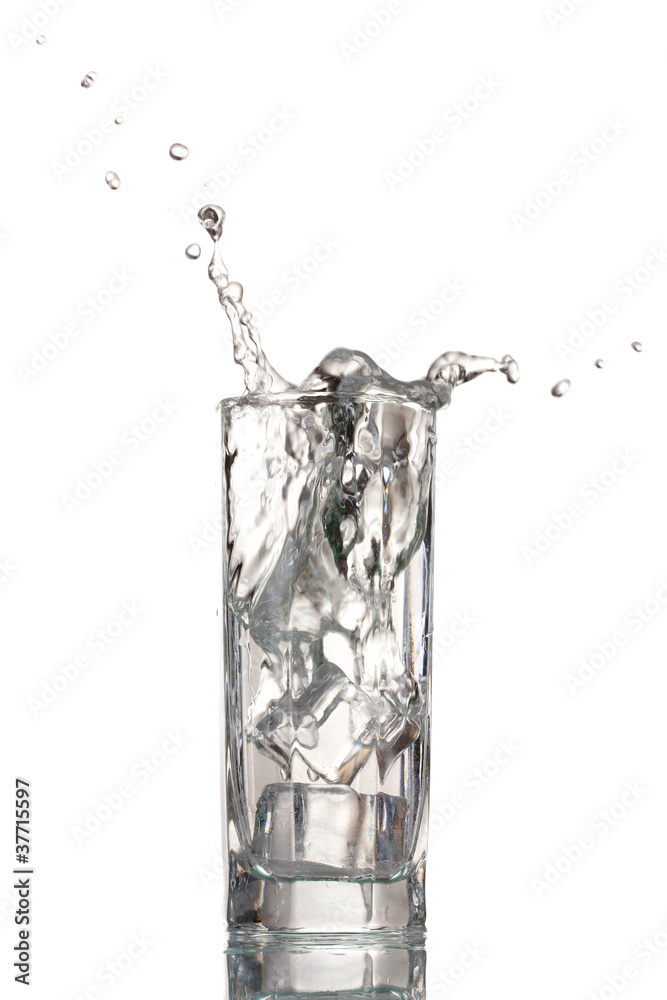 fresh water in glass with ice cubes isolated on white