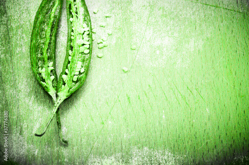 Naklejka dekoracyjna Peppers background in grunge green style