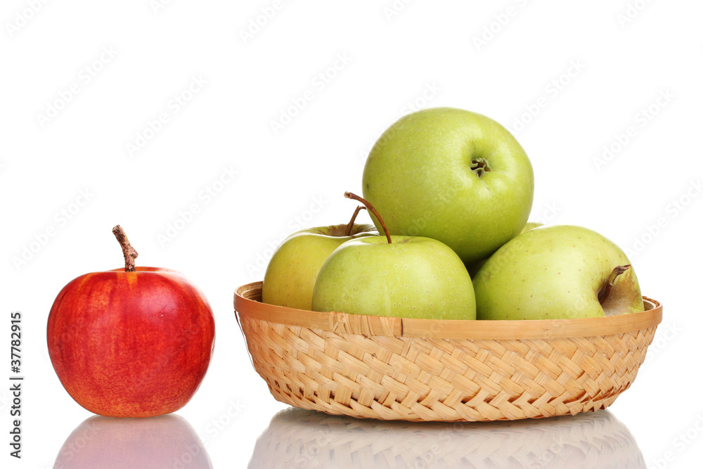 juicy green apples in the basket and red apple isolated on white