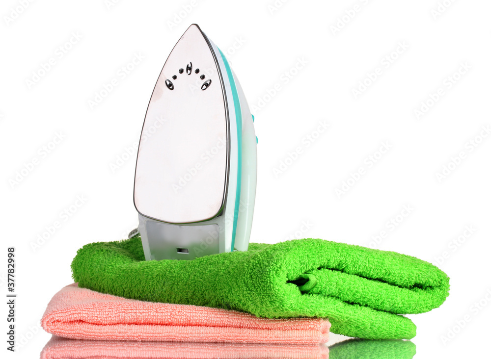 Two towels and iron isolated on white