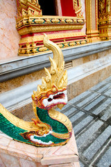 Wall Mural - Buddhist statue at a temple in Thailand - travel and tourism.