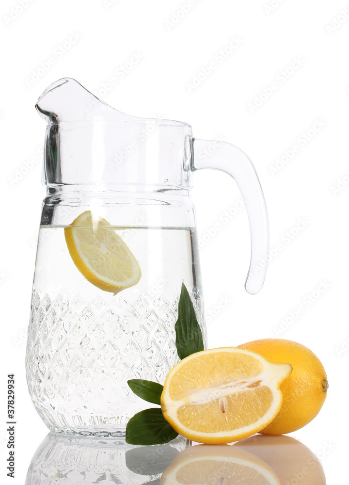 pitcher of lemonade and lemon isolated on white