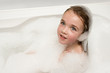 Little girl in soap foam