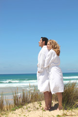 Wall Mural - couple in robes on the beach