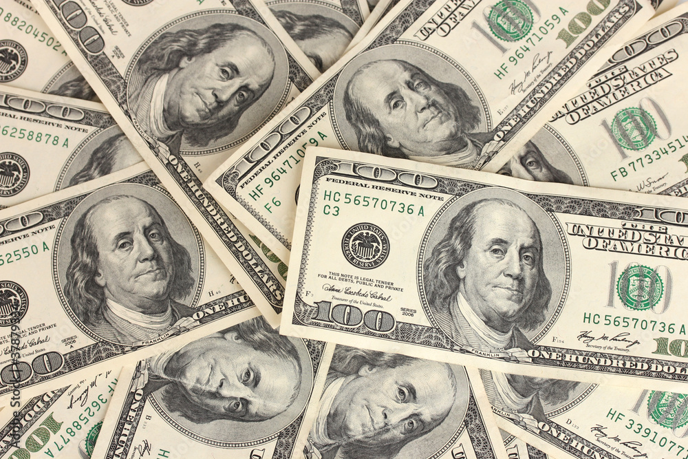 A lot of one hundred dollar bills closeup