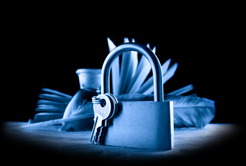 Wall Mural - A feather, inkpot, old book and keylock in blue