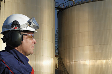 Wall Mural - engineer in close-ups and oil refinery