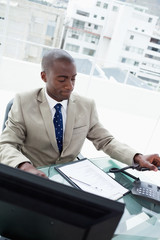 Wall Mural - Portrait of a businessman hanging up