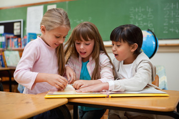 Poster - Little schoolgirls reading a fairy tale