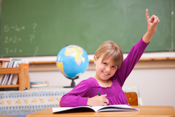 Aufkleber - Schoolgirl raising her hand to ask a question