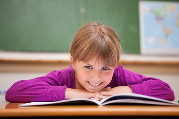 Poster - Schoolgirl leaning on a desk