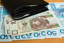 Polish Money - Zloty, Banknotes And Wallet On The Table
