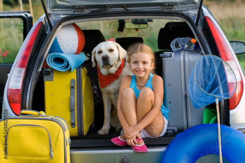 Obraz w ramie Girl with dog ready for travel for summer vacation