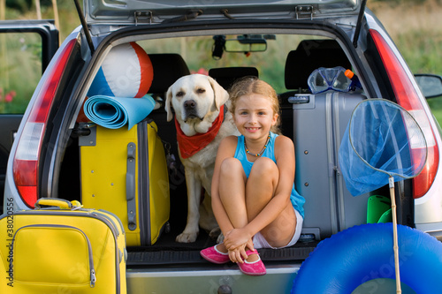 Naklejka na drzwi Girl with dog ready for travel for summer vacation