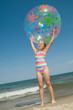 © Gorilla - Happy summer vacation - girl playing on the beach