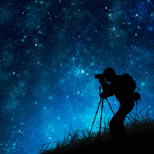 Silhouette Of Photographer Shooting Stars