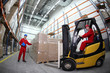 © endostock - two workers  loading pallets  with  forklift truck