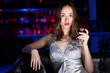© Sergey Nivens - Young woman in night club with a drink
