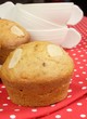 almond muffins and stack of cups